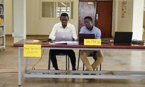 Derrick Wanda, a library staff member, sensitizing a Busitema University student on scholarly networks such as ORCID, Academia.edu, and Google Scholar during Day 2 of the International Open Access Week celebrations at the Faculty of Engineering Library, Busitema University, on 21st October 2025.