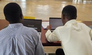 Derrick Wanda, a library staff member, sensitizing a Busitema University student on scholarly networks such as ORCID, Academia.edu, and Google Scholar during Day 2 of the International Open Access Week celebrations at the Faculty of Engineering Library, Busitema University, on 21st October 2025.